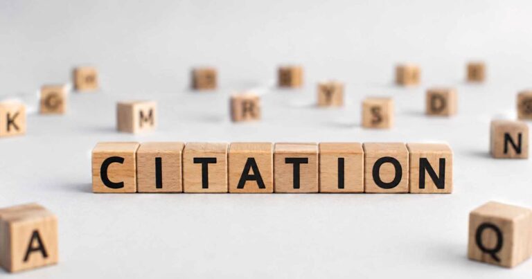 Wooden blocks spelling citation for Wyoming local SEO citation sites article
